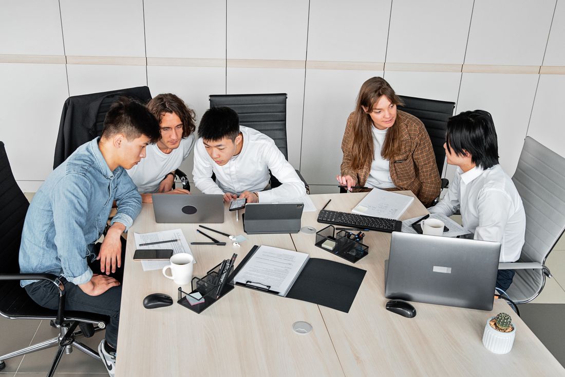Home Supetama007 team discussing a staffing brief with a client