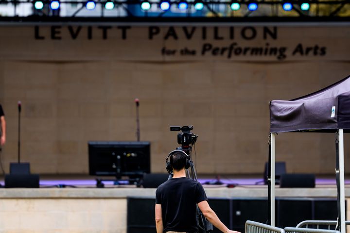 Home Event crew setting up equipment at a live venue