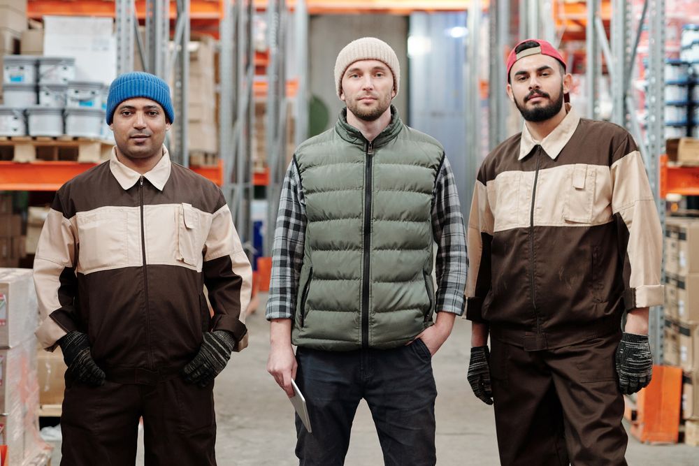 Home Vetted temporary workers standing in a warehouse ready for a shift
